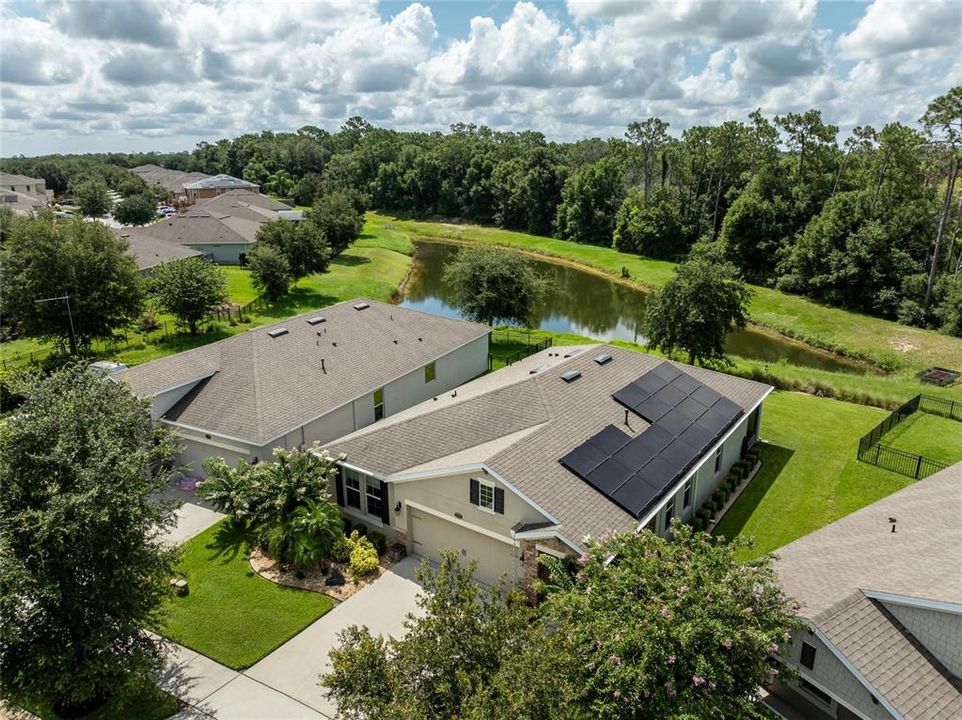 Overhead view of home and pond.