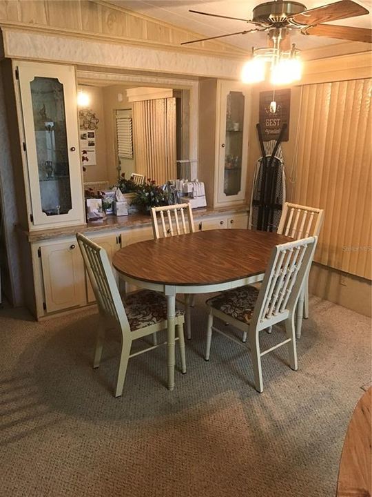 DINING ROOM WITH BUILT IN CHINA CABINET.