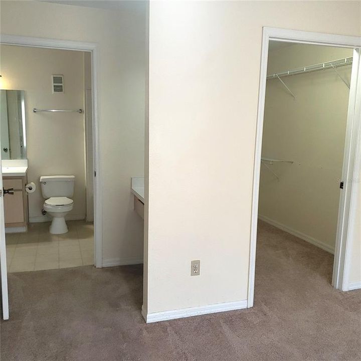 Standing in Bedroom, looking toward Closet on right and Dressing room and Bathroom on left