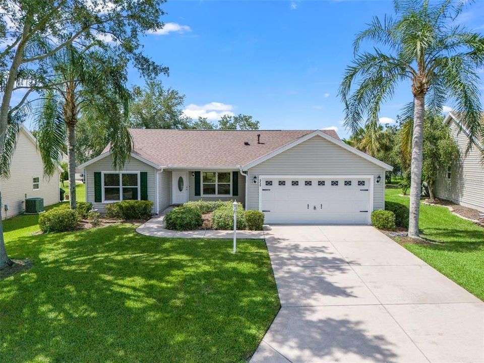 Matured Landscape surrounds this Cottage Style home.