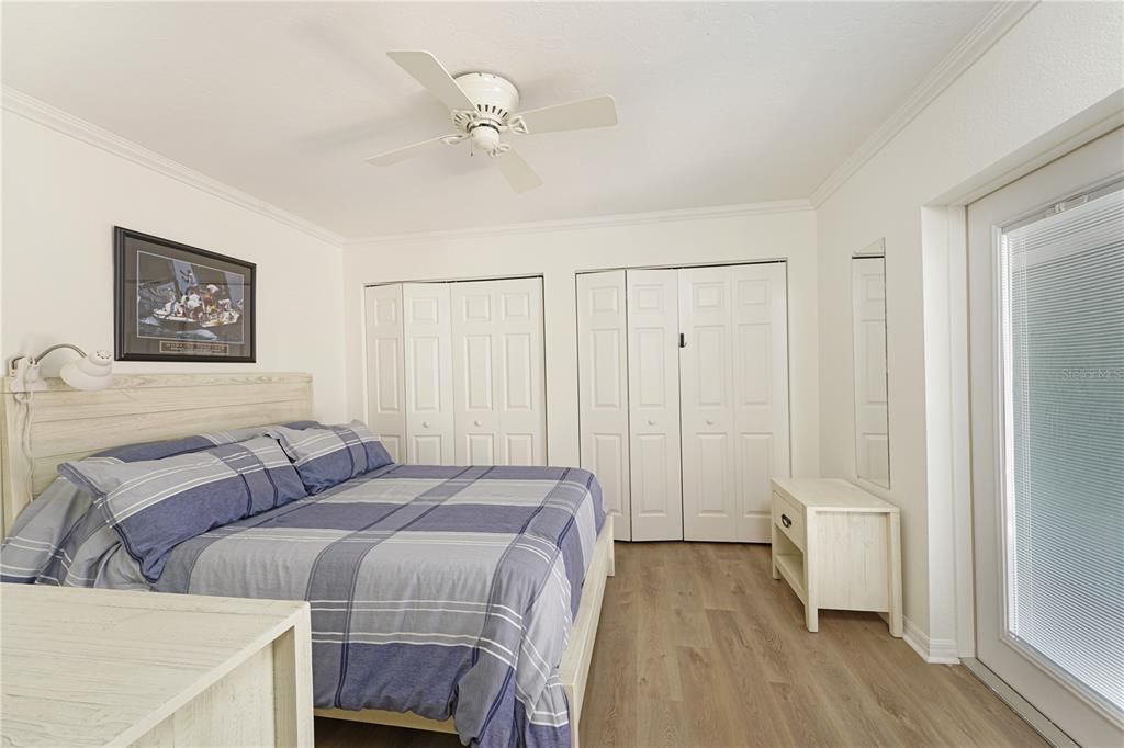 THE GUEST BEDROOM WITH LUXURY VINYL COASTAL PLANK FLOORING