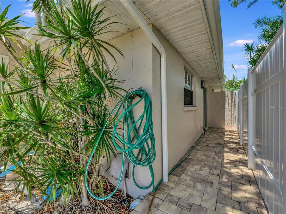 Walkway from outdoor oasis to master bathroom