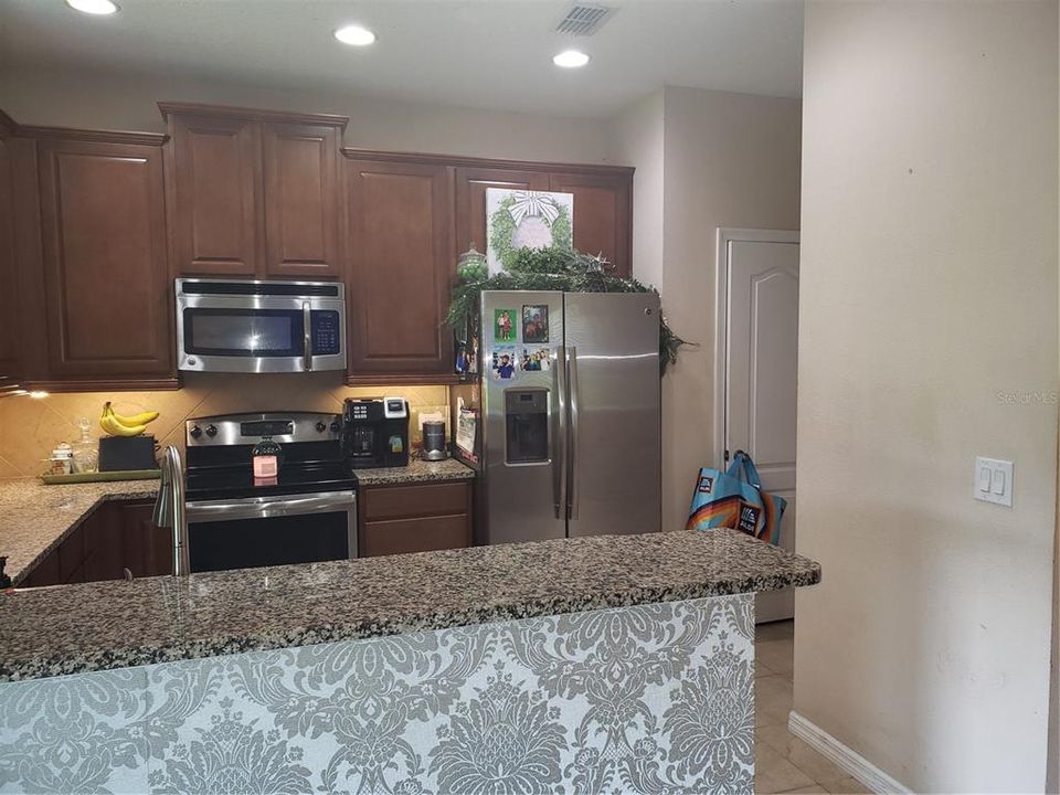 Closet Pantry next to Refrigerator