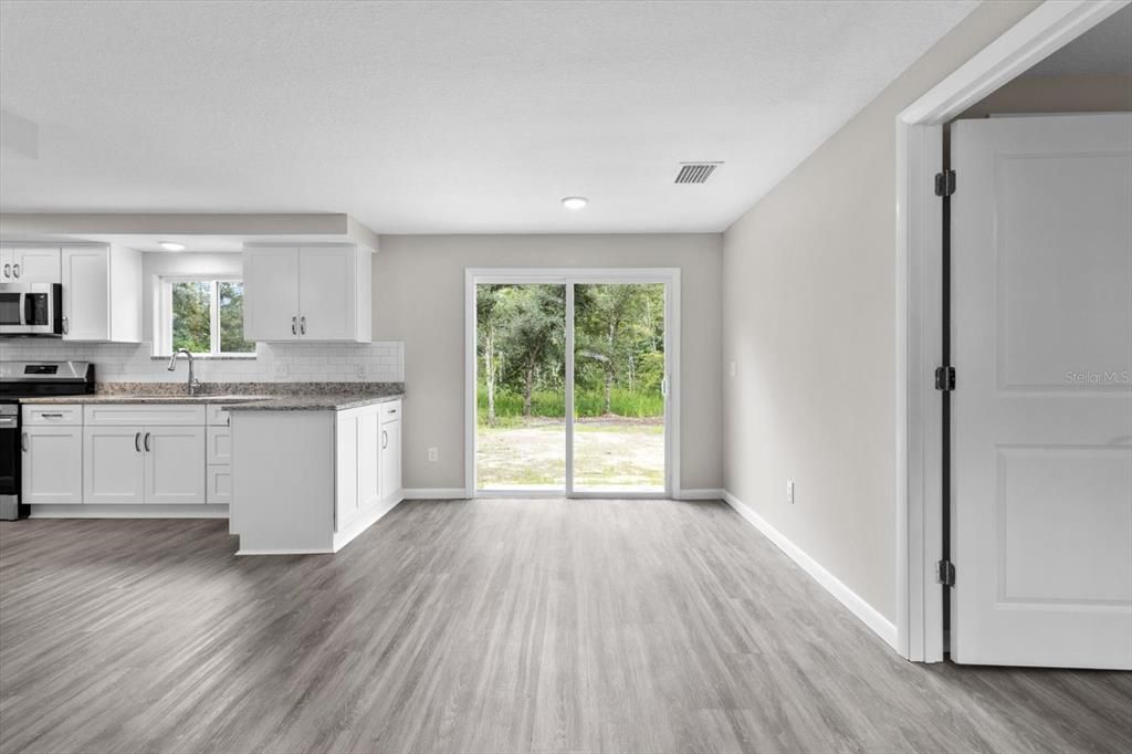 Dining Area w/ Slider...Master Bedroom on the Right