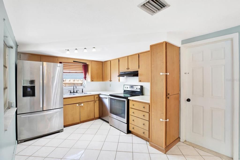 Kitchen with Stainless steel appliances.