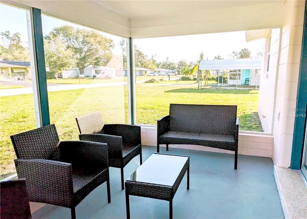 Screened in porch with sliders to Living Room area.