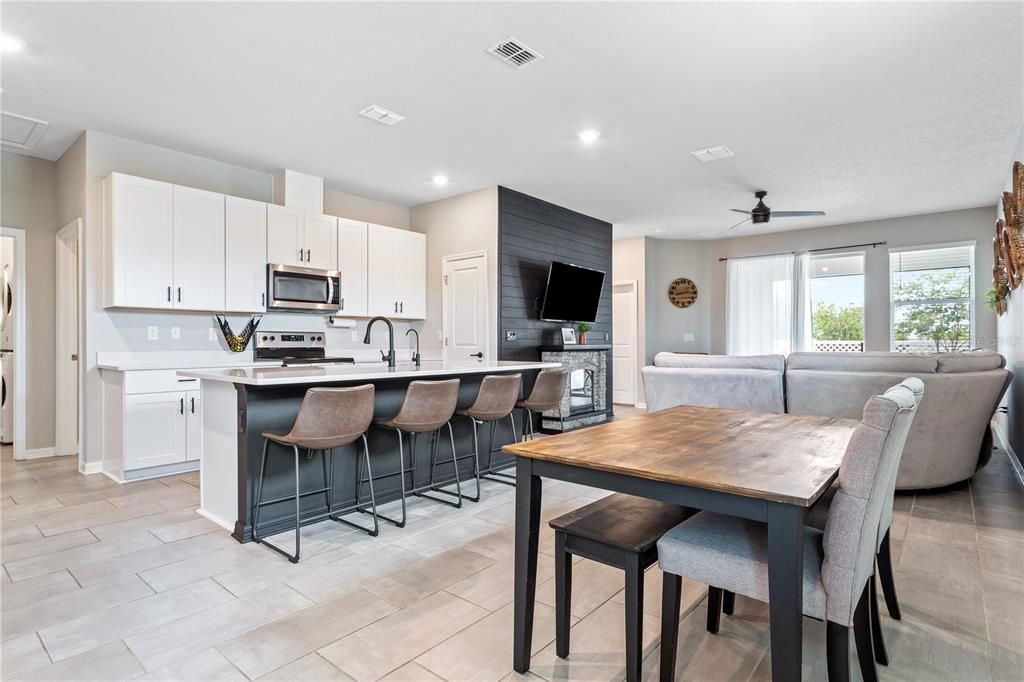 Welcome to this bright and open floor plan with dining area and kitchen just off the living room and full view to the lanai.