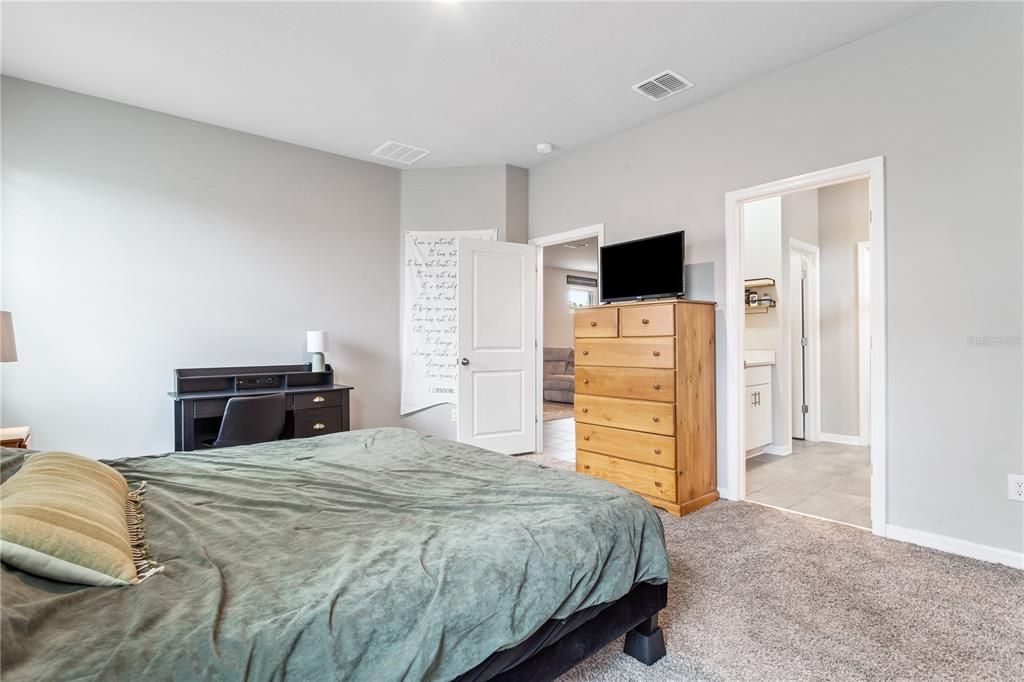 Primary bedroom with ensuite bath and walk in closet.