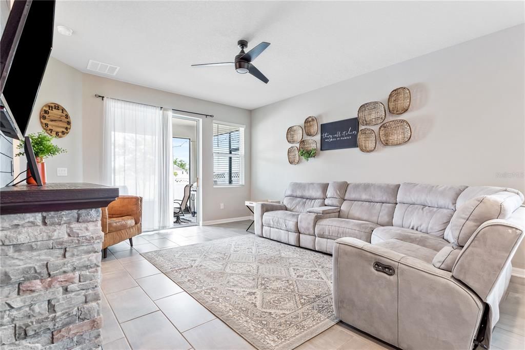 Large living room with accent wall perfect to hang a tv.