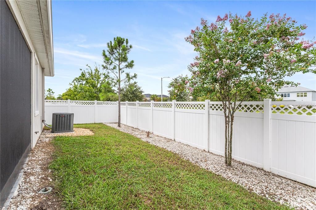 Screened in paver lanai with fenced back yard.