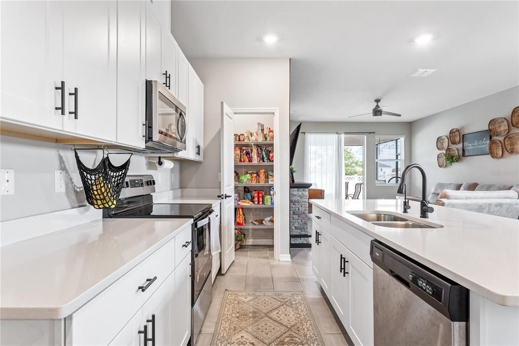 Tile flooring throughout the main living space, closet pantry, and tall ceilings.