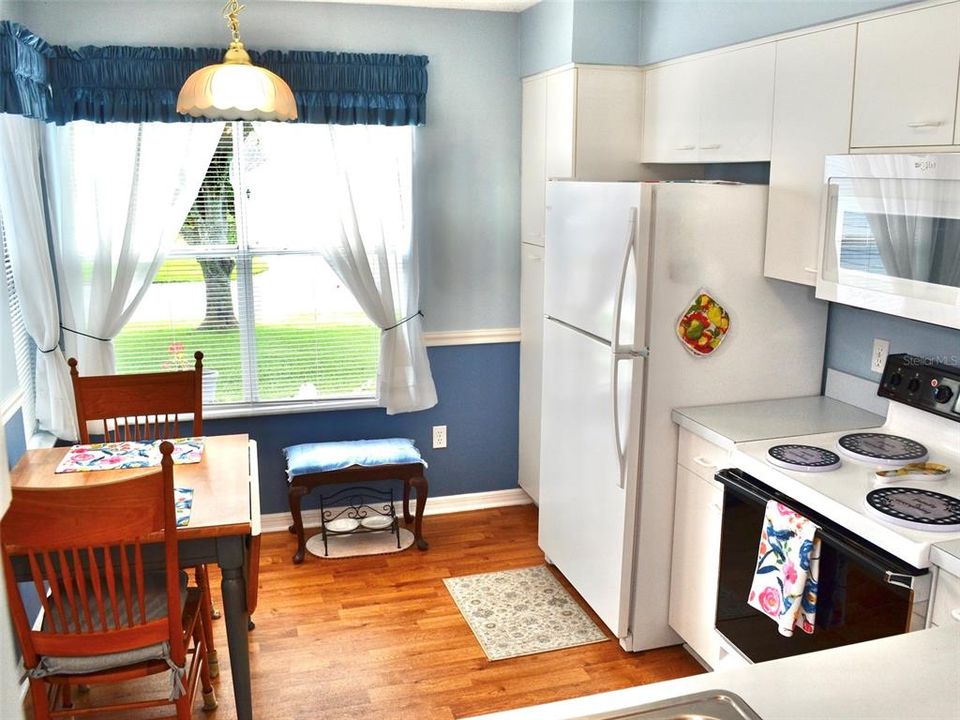 Kitchen has resilient "Wears like Iron"wood look linoleum flooring.