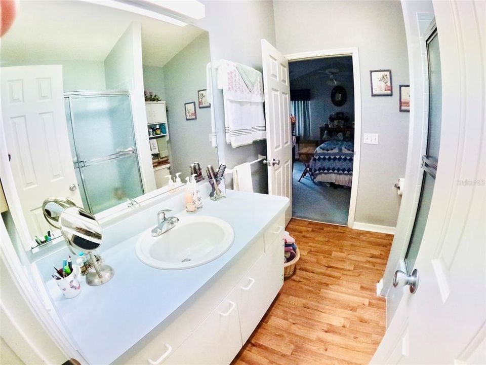 shared master guest bathroom. "Wears like Iron"wood look linoleum flooring.