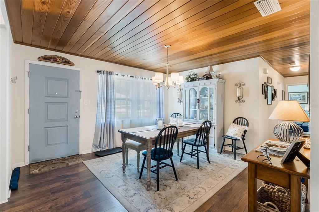 View of front door and dining room