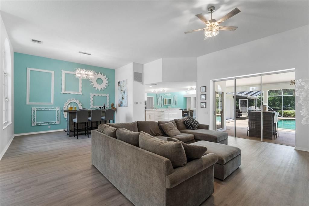 Formal living room with sliders to the pool and patio