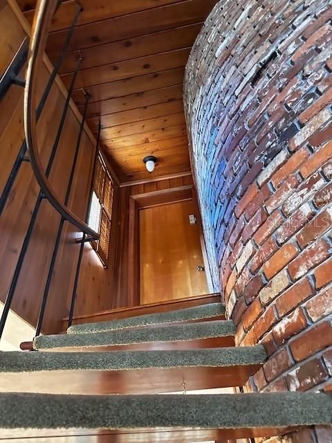 The exposed brick and curvature of the staircase!