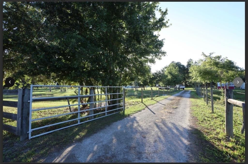 Gated driveway leading o the home