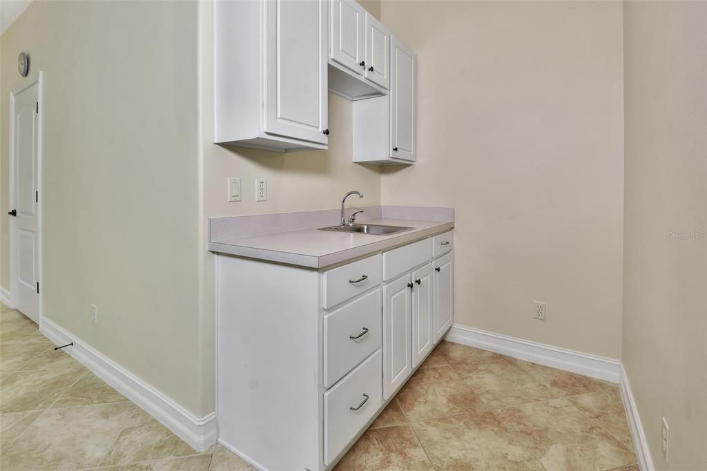 Sink and cabinets in Bedroom 4