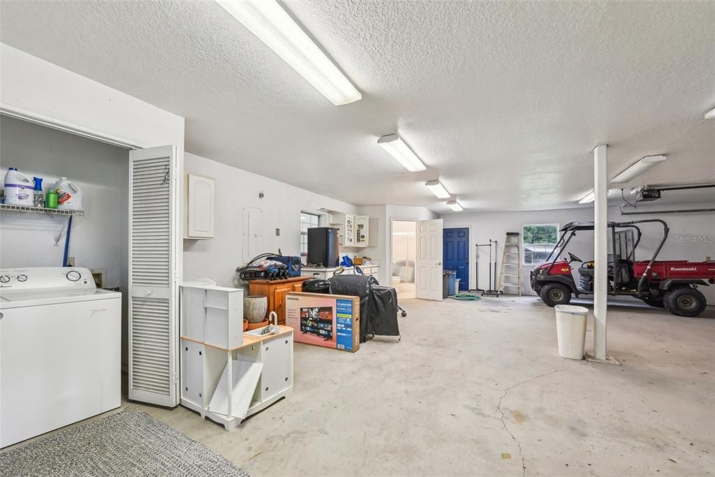 Oversized 3 car garage with second laundry