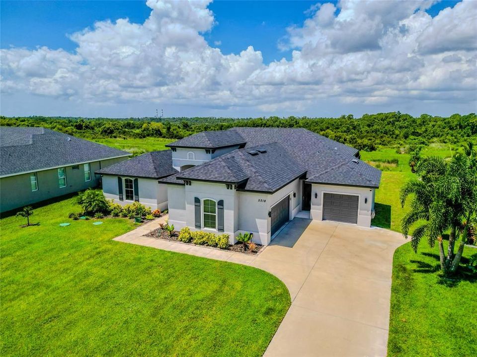 This .52 acre Conservation Lot home features a 3 Car Garage. Front facing Garage is 279 sq ft. Side entry Garage houses 2 cars and is 503 sq ft according to builder's floor plans.