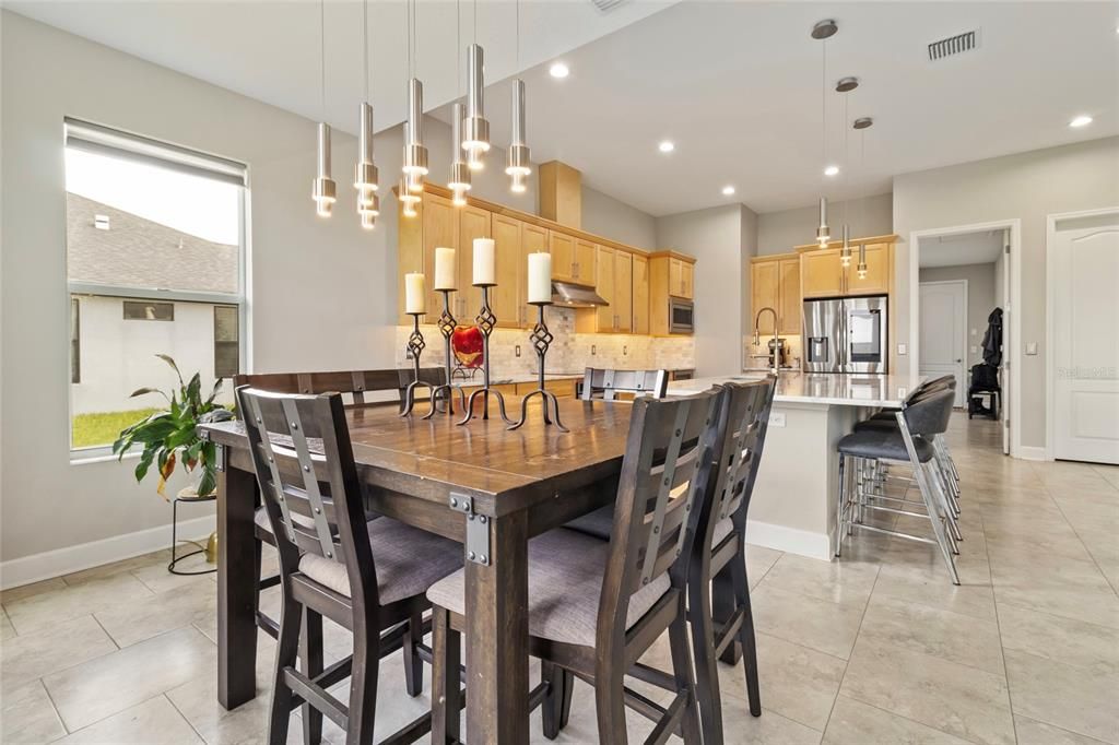 The soft gold in the lighting fixtures perfectly plays off of the warmth of the cabinetry.