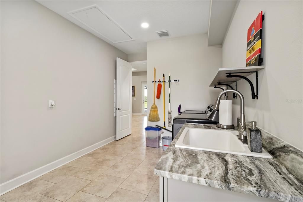 There are two utility sins. This one with granite counter top and the other located in the single car garage-is a utility sink.