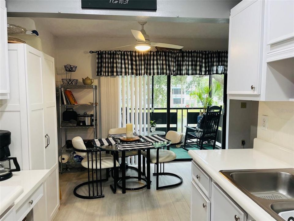 Eating area in kitchen leads to balcony