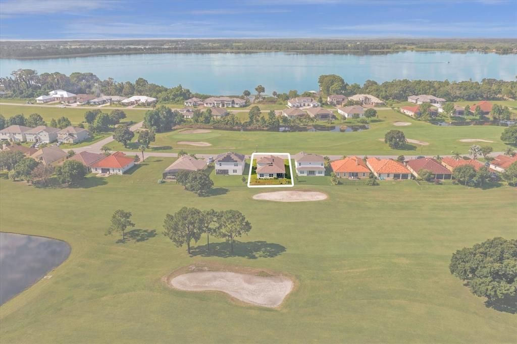 Property outline from rear of the house showing golf course in front and behind house with Lake Beauclair in view.