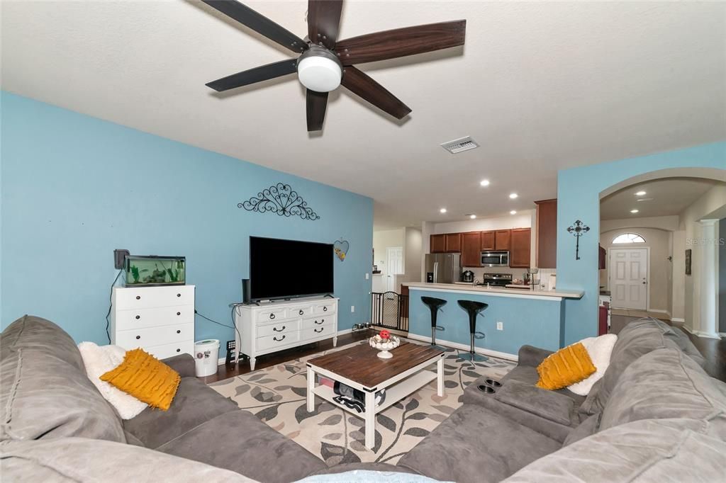 looking from living room towards kitchen/front hallway