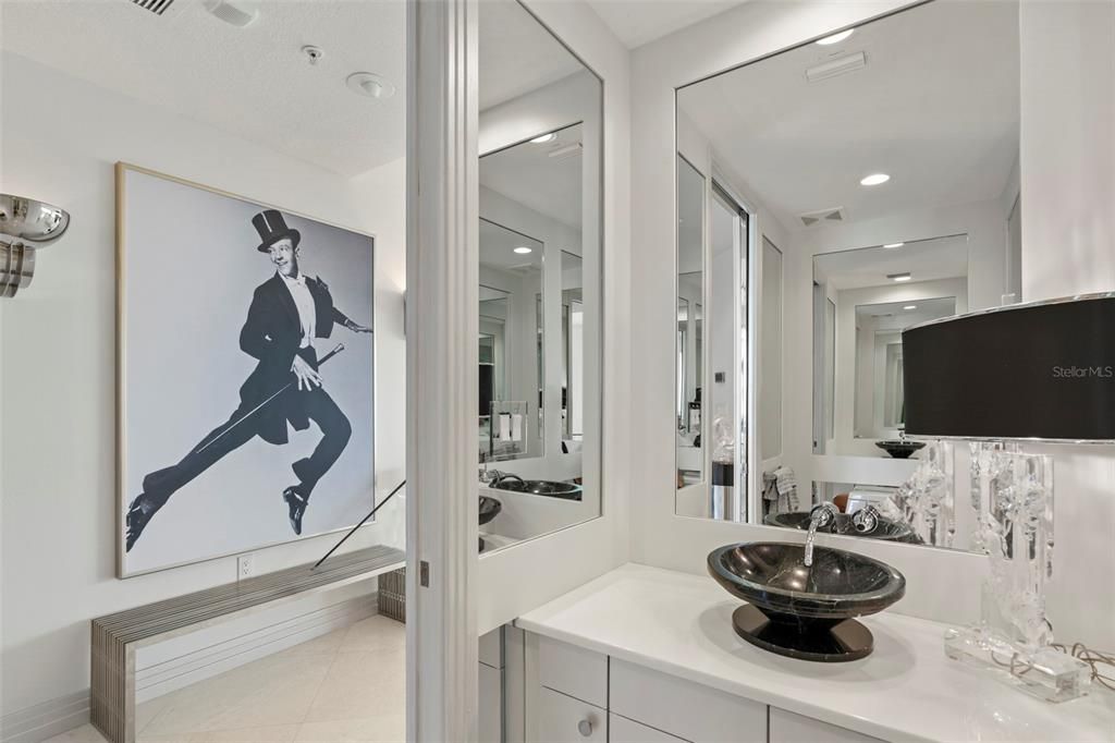 A well-appointed and renovated powder room is located just off the entertaining spaces.