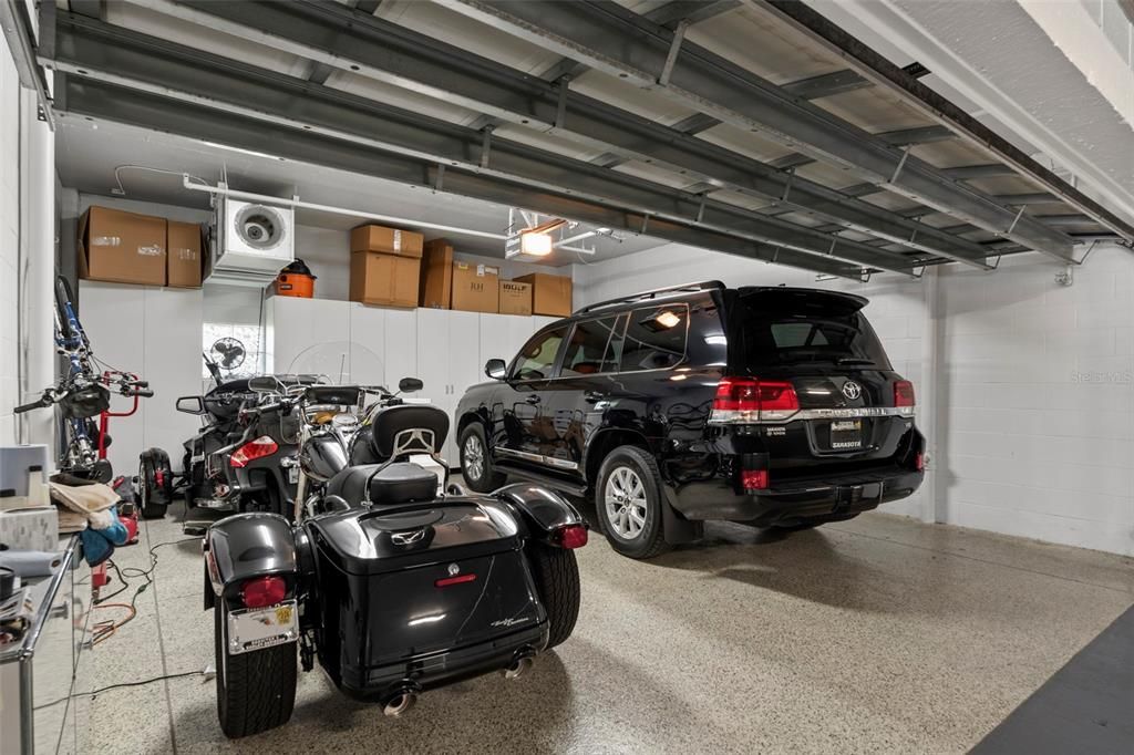 The garage has custom storage and an epoxied floor.