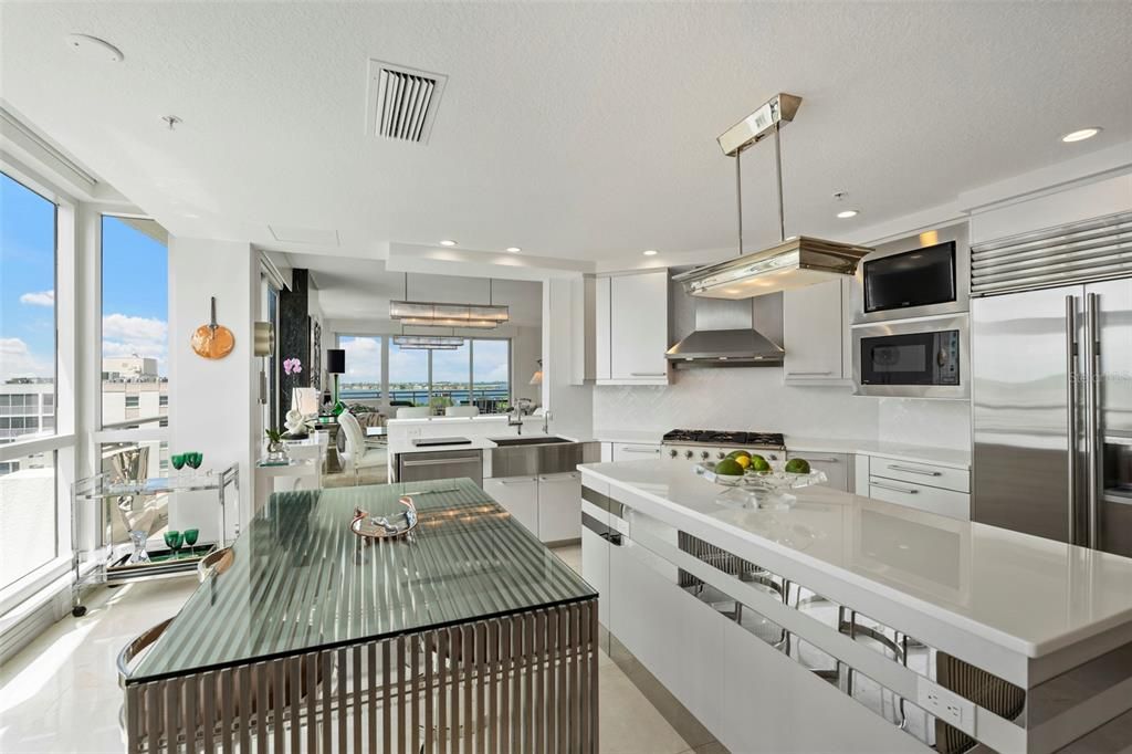 The kitchen features a Subzero refrigerator, Bosch dishwasher, and an under counter beverage refrigerator.