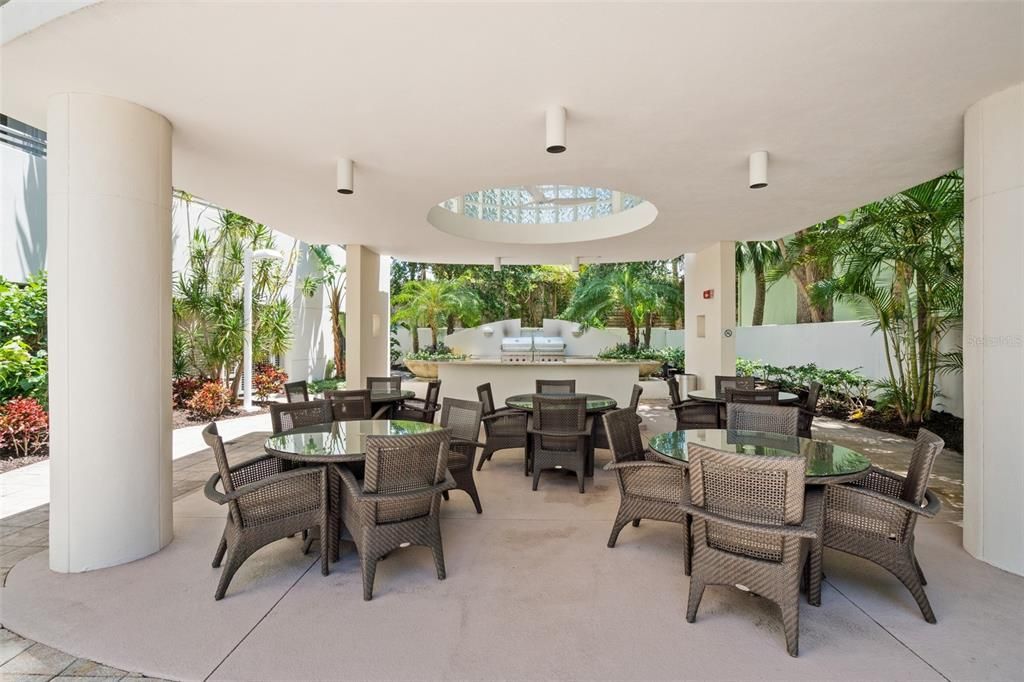 Amenities include barbecue area and outdoor dining space