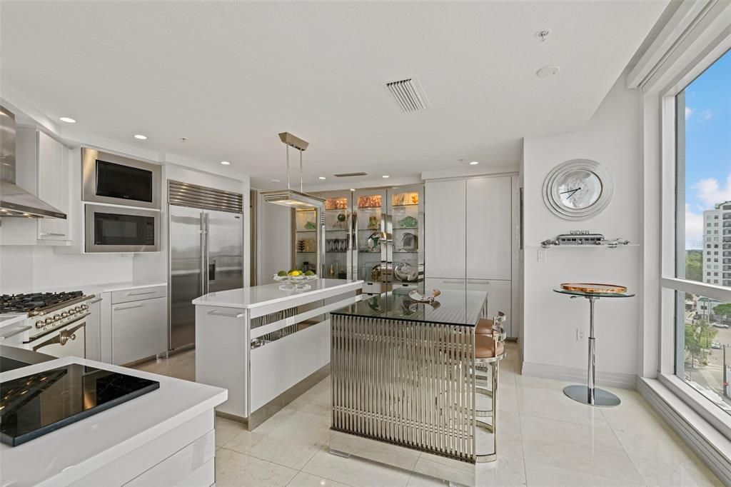 The state-of-the-art kitchen features white Poggenpohl cabinetry.