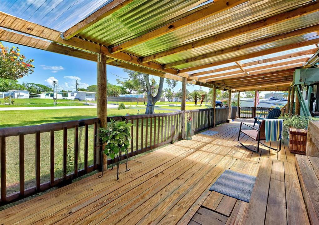 Rustic covered front porch.  The perfect place to sit and enjoy the outdoors on a rainy day.