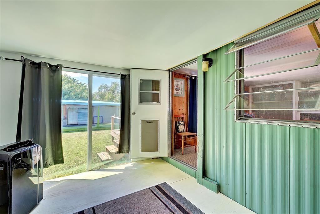 Bonus room has a sliding glass doors to the back yard and pool.