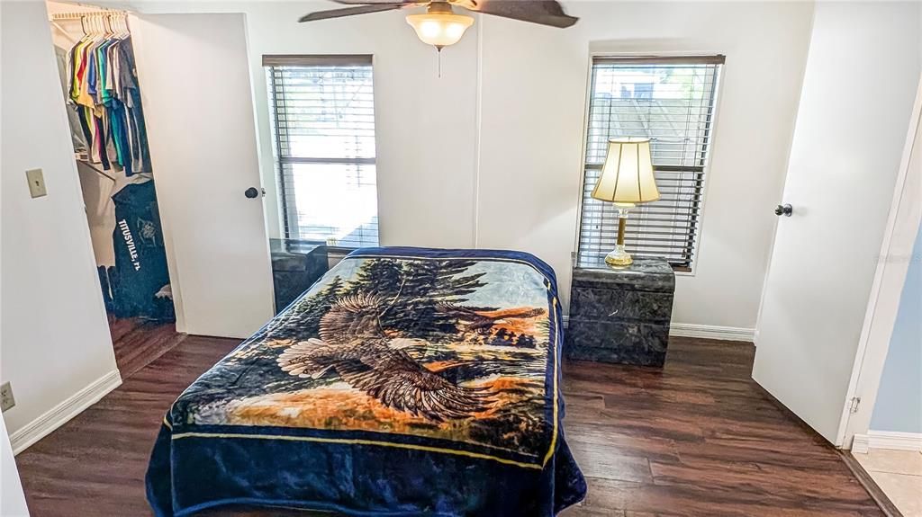 View of Master Bedroom as seen from Entrance with Large Walk in Closet to Left and Entrance to Master Bath on Right!