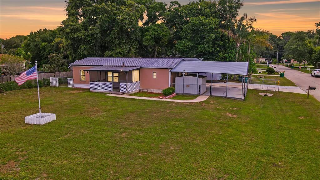 Gorgeous and Affordable THREE-Bedroom, Two-Bath Manufactured Home with a METAL ROOF and THREE-Car Oversized Carport Parking with Bonus WORKSHOP on a HUGE Quarter-Acre Lot with NO HOA! HOLY COW!