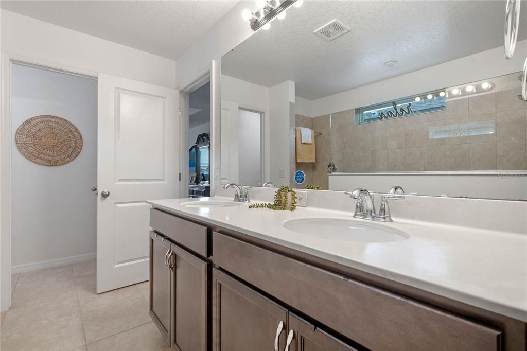 Primary Bathroom with Dual Sinks and Separate Water Closet