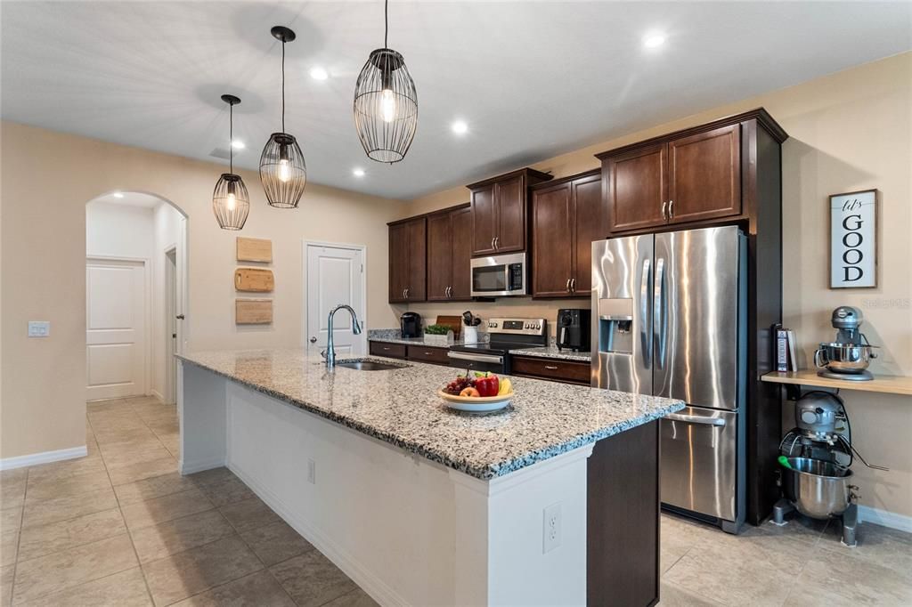 Chef's Kitchen with Walk-In Pantry with Mudroom and Laundry Room off to the side