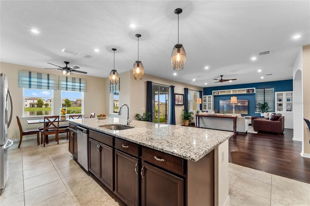 Oversized Kitchen and Island overlooking Family Room and Backyard