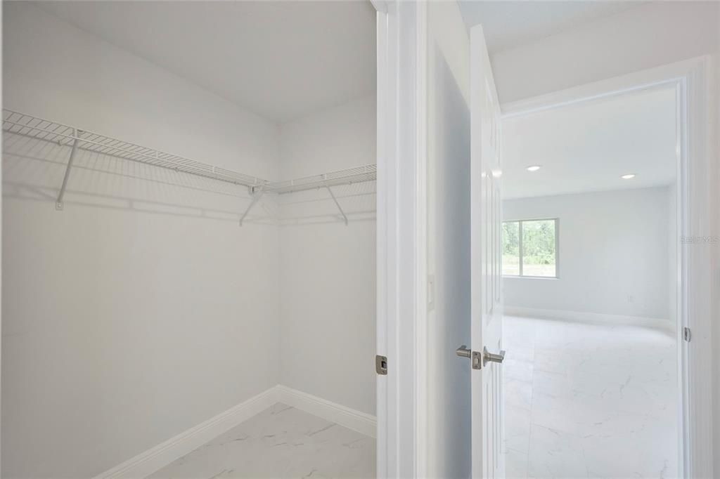 View of master walk-in closet.