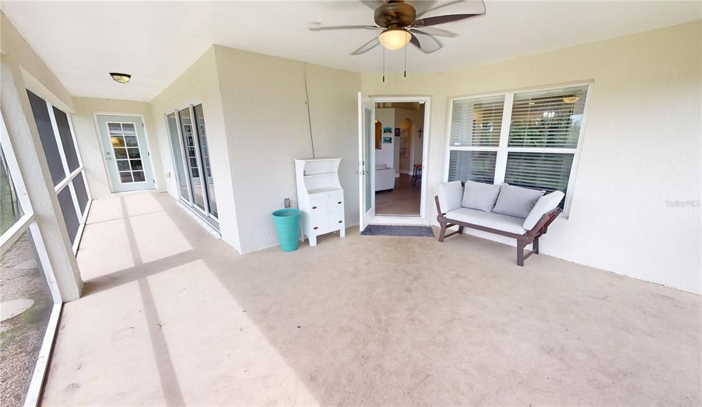 Screened and roofed rear lanai - access from great room & primary bedroom