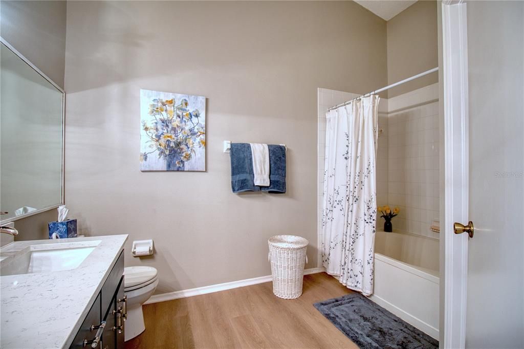 Beautiful updated bathroom with quartz countertops