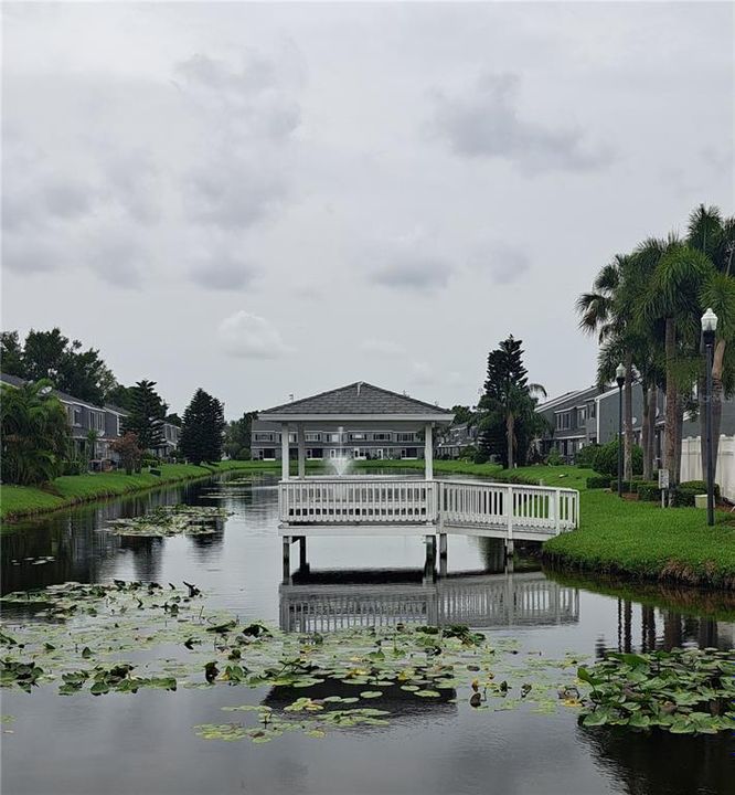 Gazebo on the neighborhood lake with fountain