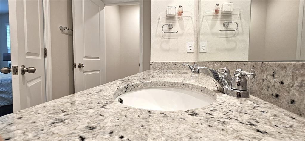 Master bathroom includes dual sinks and granite countertops