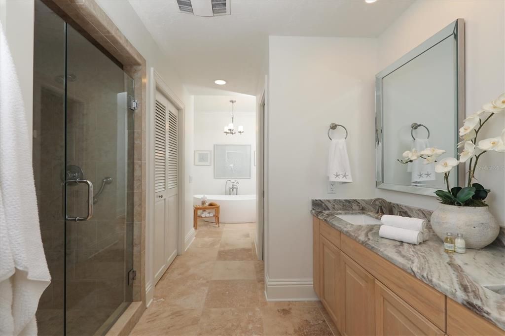 2nd floor Primary bathroom with dual vanities, shower and Tub area.