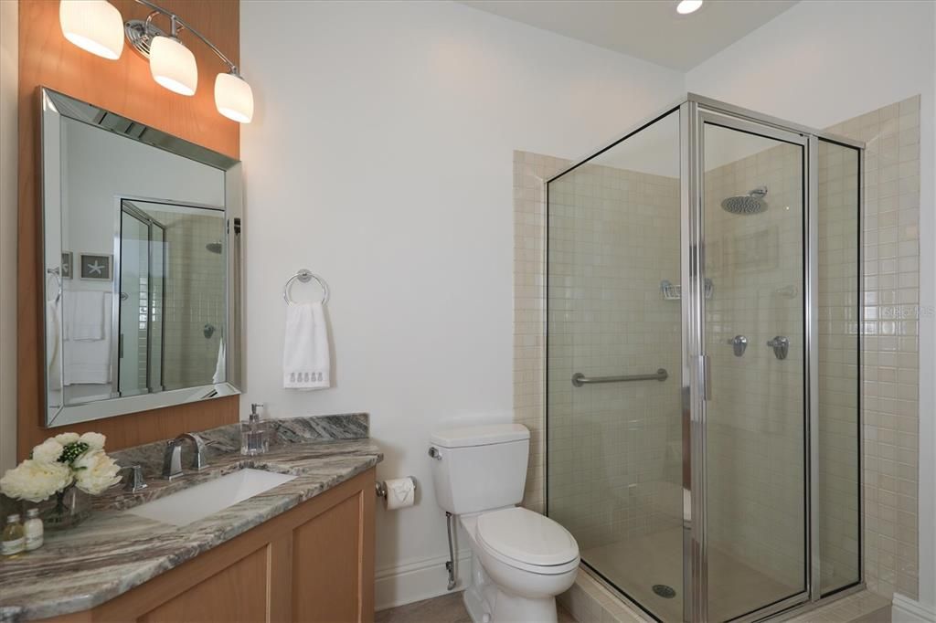 Upstairs guest bathroom with shower.