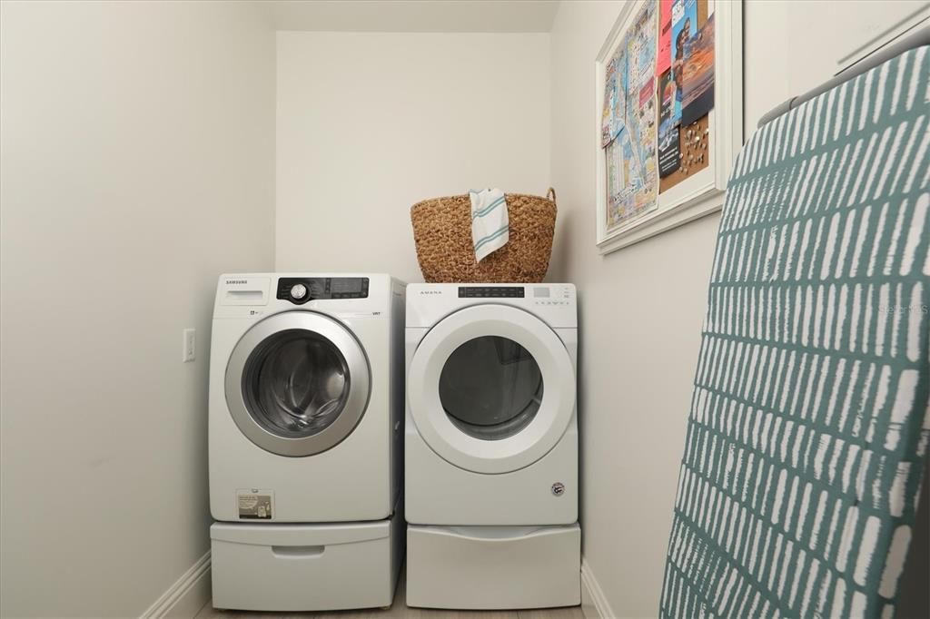 Extra Large laundry machines in L. room.