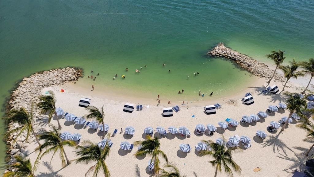 size of people in picture gives perspective to how large this "private" beach is